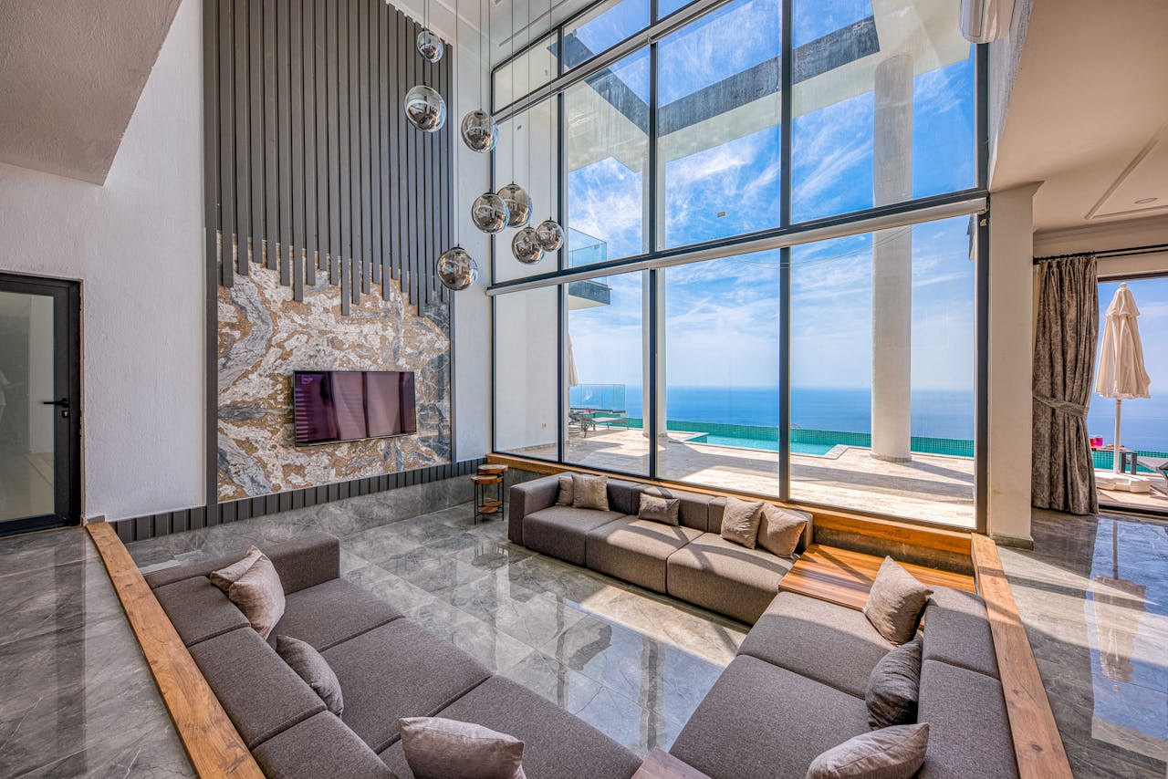 Spacious living room with ocean views, modern design, and elegant decor.